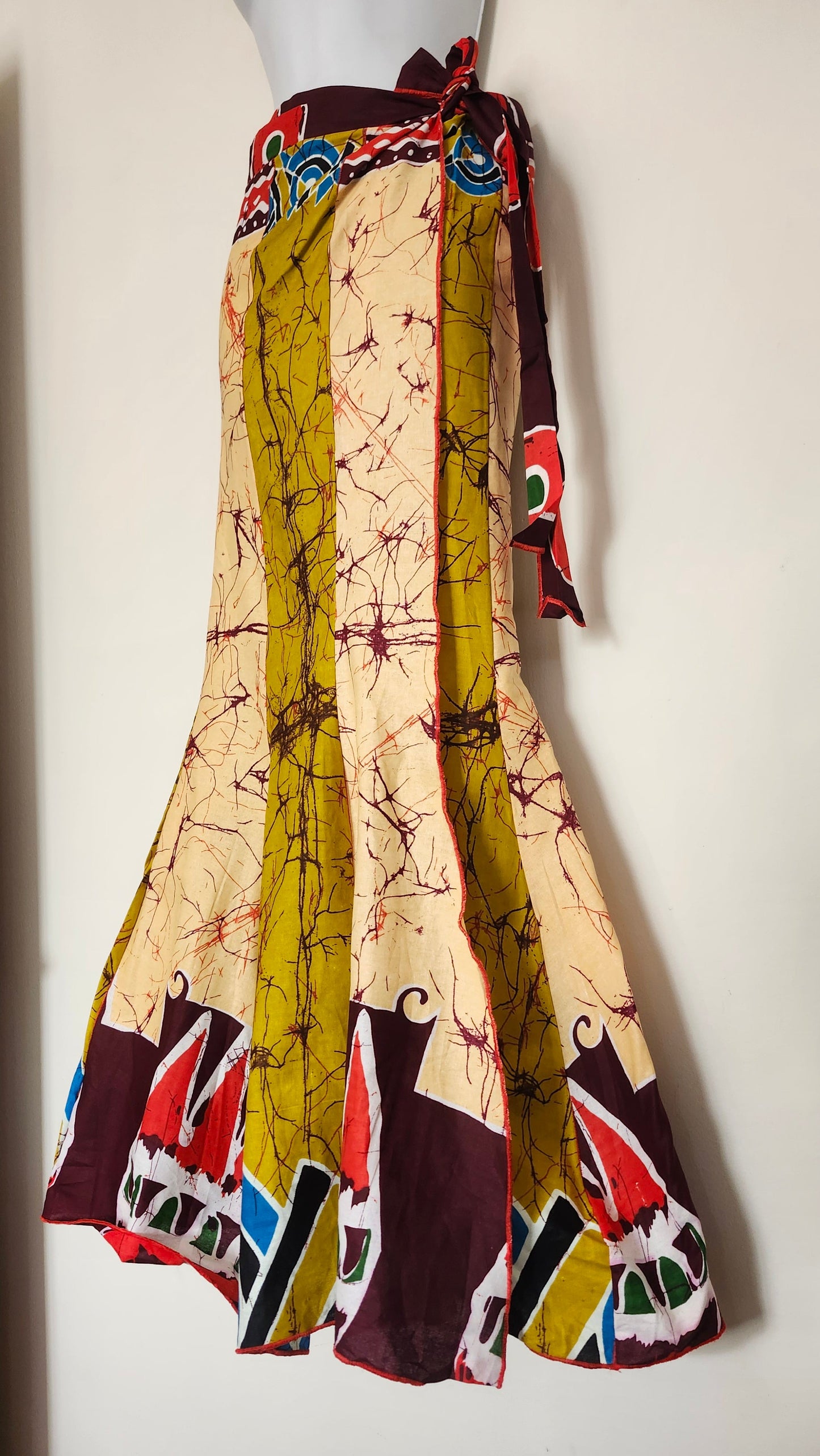 Colorful fabric with batik patterns on a white background