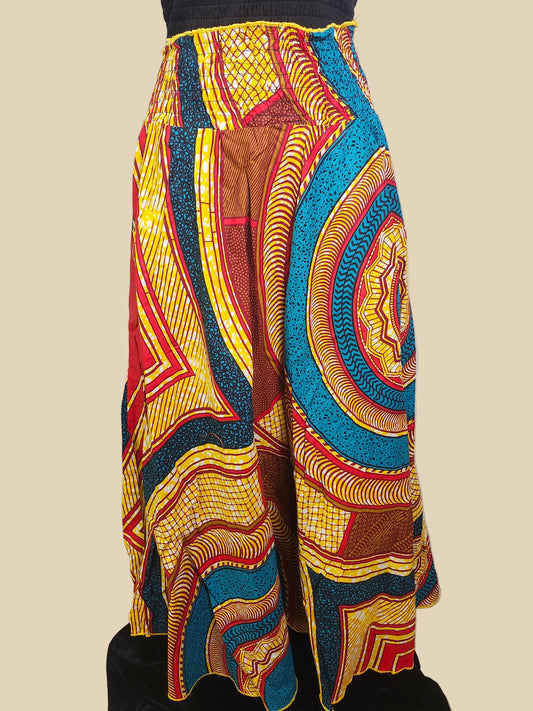 Colorful patterned fabric draped over a chair against a neutral wall.