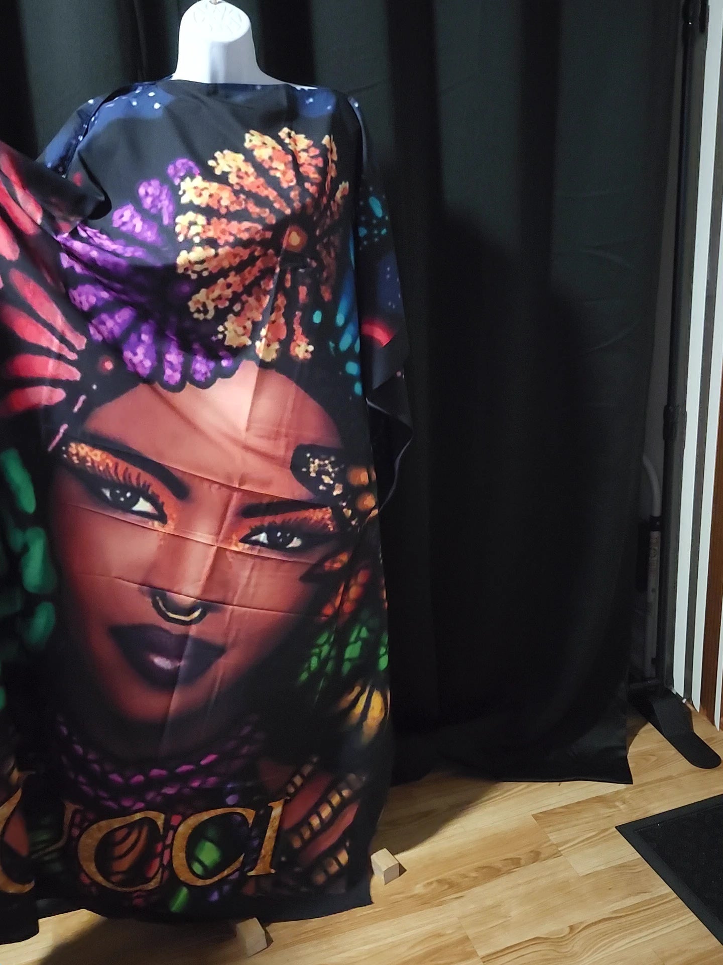 Colorful black,red, purple, green, blue and orange dress with a face design