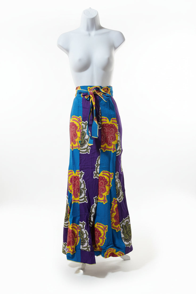 Colorful patterned belt on a mannequin against a wooden floor background
