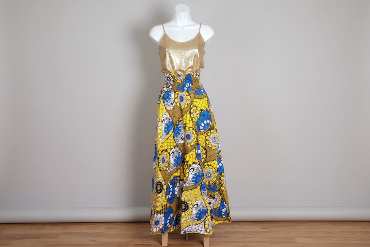 Mannequin wearing a colorful patterned skirt with a plain background