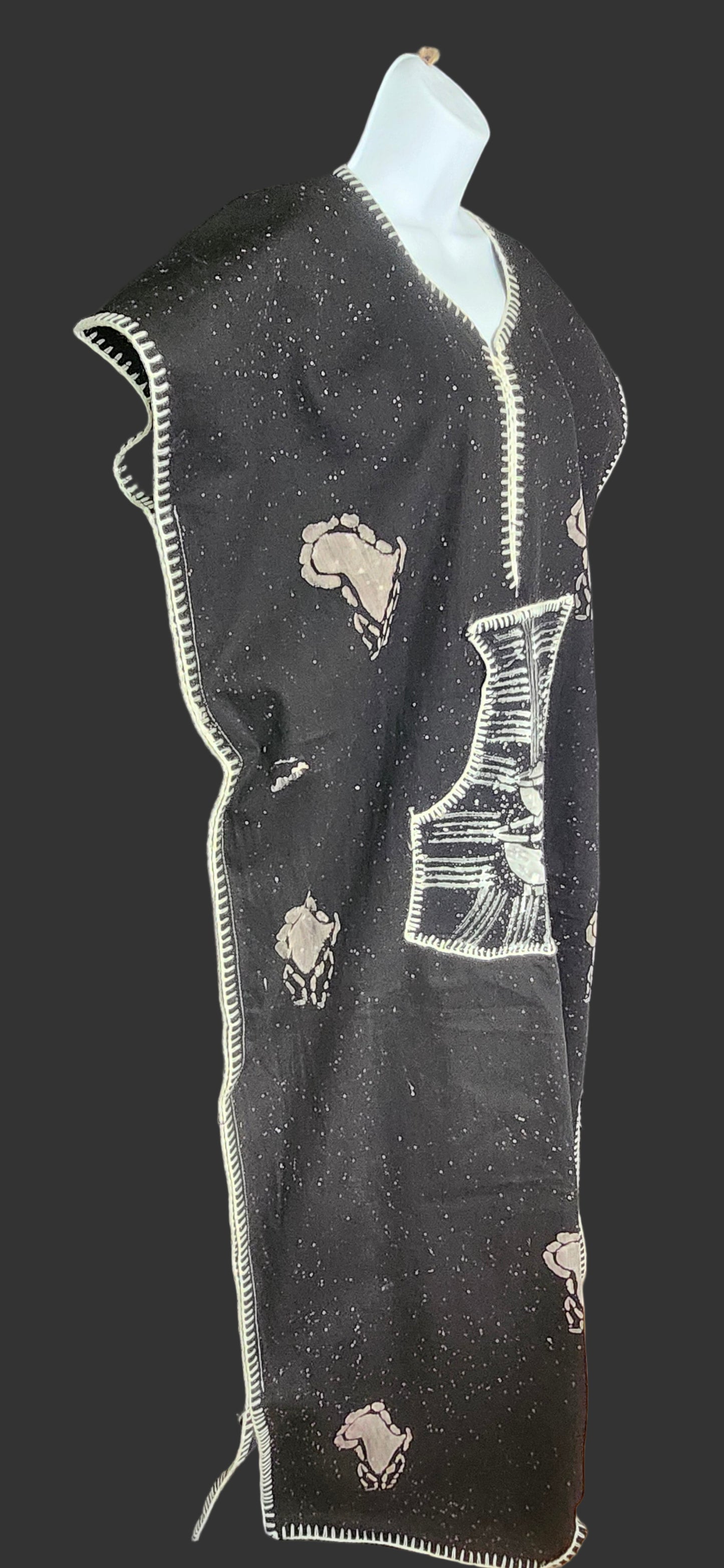 Side view of black kaftan on mannequin