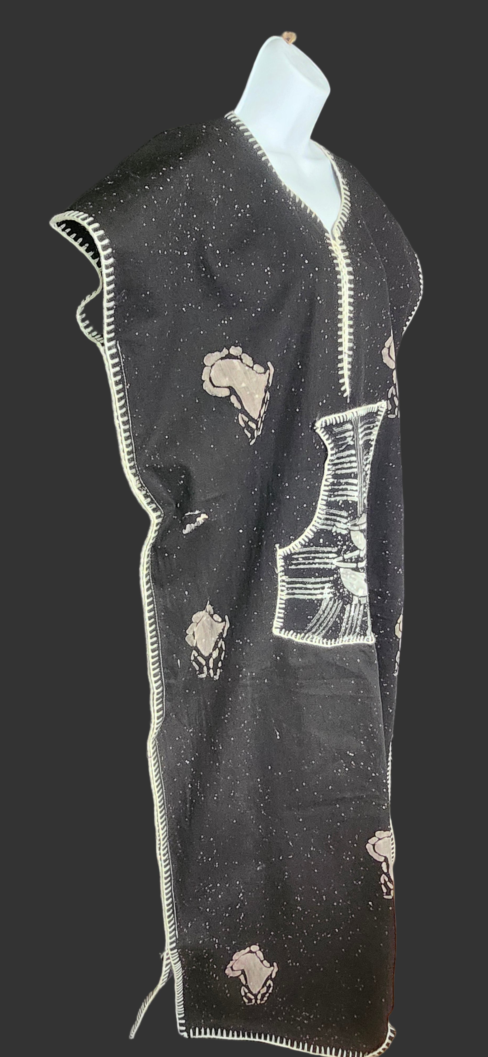 Side view of black kaftan on mannequin