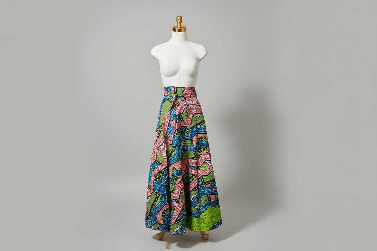 Colorful patterned belt on a mannequin bust against a black surface.